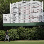 Tiger Woods walks past a leaders' board on the 11th hole during the second round of the 2008 Masters golf tournament at the Augusta National Golf Club in Augusta, Ga., Friday.