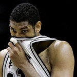 San Antonio Spurs forward Tim Duncan wipes his face as he prepares to shoot a free throw against the Phoenix Suns during the first quarter in Game 1 of a first-round Western Conference playoff basketball series in San Antonio, Saturday, April 19, 2008. (AP Photo/Eric Gay)