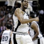 San Antonio Spurs forward Tim Duncan reacts after he made a three-point shot against the Phoenix Suns during the end of their first overtime in Game 1 of their Western Conference playoff basketball series in San Antonio, Saturday, April 19, 2009. San Antonio won 117-115 in double-overtime; Duncan scored 40 points. (AP Photo/Eric Gay)