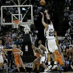 San Antonio Spurs forward Tim Duncan (21) shoots a three-point shot against the Phoenix Suns during the end of their first overtime in Game 1 of their Western Conference playoff basketball series in San Antonio, Saturday, April 19, 2009. Duncan made the shot forcing a second overtime. San Antonio won 117-115 on double-overtime; Duncan scored 40 points. (AP Photo/Eric Gay)
