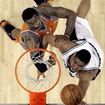 San Antonio Spurs forward Tim Duncan, right, is defended by Phoenix Suns forward Amare Stoudemire, left, during the second half in Game 1 of their Western Conference playoff basketball series in San Antonio, Saturday, April 19, 2009. San Antonio won117-115 in double-overtime; Duncan scored 40 points. (AP Photo/Eric Gay)