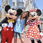 In this image released by Disney, Miley Cyrus from the Disney Channel's "Hannah Montana" poses with Disney characters Mickey Mouse and Minnie Mouse at the Magic Kingdom at Walt Disney World Resort in Lake Buena Vista, Fla., on Thursday, May 1, 2008. Cyrus was in town to promote the "Disney Channel Games," a made-for-television, Olympic-style competition that will air this summer on the Disney Channel. (AP Photo/Disney, Garth Vaughan)) 