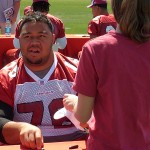 Cardinals guard Deuce Lutui signs an autograph for a fan during the Arizona Cardinals Fan Fest on Saturday, May 3 at the Cardinals training facility in Tempe.

(Courtesy of Jay Chapman/Sports 620 KTAR)