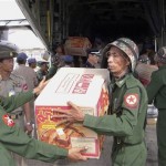Myanmar soldiers unload boxes of supplies from a Thai transport plane at Yangon airport in Myanmar Tuesday, May 6, 2008. Myanmar's Irrawaddy delta, where nearly 22,000 people perished, remained largely cut off from the rest of the world Tuesday, four days after a cyclone unleashed winds, floods and high tidal waves on the densely populated region. (AP Photo)