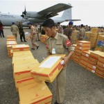 Myanmar soldiers unload boxes of supplies from a Thai transport plane at Yangon airport in Myanmar Tuesday, May 6, 2008. Myanmar's Irrawaddy delta, where nearly 22,000 people perished, remained largely cut off from the rest of the world Tuesday, four days after a cyclone unleashed winds, floods and high tidal waves on the densely populated region. (AP Photo)
