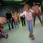 Sasha Obama, a daughter of Democratic presidential hopeful, Sen. Barack Obama, D-Ill., roller skates towards Sen. Obama as her mother, Michelle, watches at Great Skates Fun Center in Lafayette, Ind., Saturday, May 3, 2008. (AP Photo/Jae C. Hong)