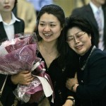 South Korea's first astronaut Yi So-yeon, left, is hugged by her mother upon her arrival at Incheon International Airport in Incheon, west of Seoul, South Korea, Monday, April 28, 2008. Yi and other crews of the Soyuz capsule that landed last week in Kazakhstan hundreds of kilometers (miles) off-target after an unexpectedly severe descent was in serious danger, according to a Russian news agency. (AP Photo/Lee Jin-man)