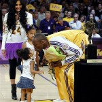 Los Angeles Lakers' Kobe Bryant, right, kisses his daughter Gianna as his wife Vanessa and other daughter Natalia watch on after he got the NBA's Most Valuable Player trophy before Game 2 against the Utah Jazz in an NBA Western Conference semifinal playoff basketball series at the Staples Center in Los Angeles, Wednesday, May 7, 2008. (AP Photo/Kevork Djansezian)