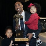 Los Angeles Lakers star Kobe Bryant holds the NBA's Most Valuable Player trophy with his daughters Gianna, right, and Natalia, left,Tuesday, May 6, 2008, in Los Angeles. Bryant received 82-first-place votes and 1,105 points in the media vote. (AP Photo/Ric Francis)