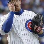 Chicago Cubs starting pitcher Ryan Dempster wipes his face after walking Arizona Diamondbacks' Justin Upton during the sixth inning of a baseball game on Saturday, May 10, 2008 in Chicago. (AP Photo/Nam Y. Huh)