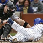 Arizona Diamondbacks catcher Chris Snyder, left, tags out Chicago Cubs' Aramis Ramirez during the second inning of a baseball game on Saturday, May 10, 2008 in Chicago. (AP Photo/Nam Y. Huh)