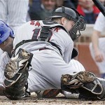 Chicago Cubs' Alfonso Soriano, left, slides safely into home plate as Arizona Diamondbacks catcher Chris Snyder tries to find the ball during the third inning of a baseball game on Saturday, May 10, 2008 in Chicago. (AP Photo/Nam Y. Huh)