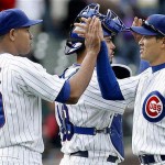Chicago Cubs' Kosuke Fukudome of Japan, right, celebrates with catcher Geovany Soto, center, and closer Carlos Marmol after the Cubs beat the Arizona Diamondbacks 7-2 in a baseball game on Saturday, May 10, 2008 in Chicago. (AP Photo/Nam Y. Huh)