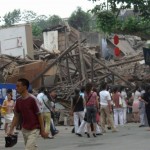 In this photo distributed by the official Chinese news agency Xinhua, the debris of collapsed buildings can be seen in Dujiangyan, a city in southwest China's Sichuan Province on Monday May 12, 2008. A massive earthquake has toppled buildings across a wide area of central China on Monday, killing more than 8,533 people, trapping hundreds of students under the rubble of schools and spilling ammonia from a chemical plant. (AP Photo /Zheng Yue, Xinhua)