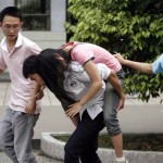Chinese students help a fainted classmate evacuate to a playground for safety in Qionglai city, southwest China's Sichuan province, Monday May 12, 2008, after a magnitude 7.8 earthquake struck mountainous central China. (AP Photo)
