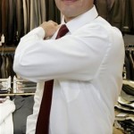 Eddie Ginez models a shirt with high arm holes and a narrow tie, all of which make the 5'7" Ginez appear taller, at Jimmy Au's For Men 5'8" And Under in Beverly Hills, Calif., Wednesday, April 30, 2008. Finding a suit that fits is getting easier for the shorter man. National chains still don't offer many options, but legions of shorter men in the country are increasingly discovering specialty stores just for them. (AP Photo/Reed Saxon)
