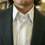 Cary Kazemi models a shirt with narrow stripes, and a jacket with stripes of a slightly different size in this closeup view, all of which make the 5'8" Kazemi appear taller, at Jimmy Au's For Men 5'8" And Under in Beverly Hills, Calif., Wednesday, April 30, 2008. Finding a suit that fits is getting easier for the shorter man. National chains still don't offer many options, but legions of shorter men in the country are increasingly discovering specialty stores just for them. (AP Photo/Reed Saxon)
