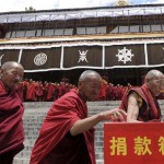 n this photo released by China's Xinhua news agency, monks of Zhaibung Monastery donate money to the quake-hit regions in Sichuan Province of southwest China, in Lhasa, capital of southwest China's Tibet Autonomous Region, Wednesday, May 14, 2008. (AP Photo/Xinhua, Chogo)