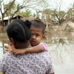 In this photo released by UNICEF, a mother and child look on at Kawhmu Township in the south-western Irrawaddy Division of Myanmar Tuesday, May 13, 2008. (AP Photo/UNICEF)
