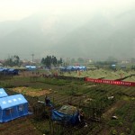 Rescuers set up temporary tents at the earthquake-hit Hongbai Township in Shenfang of southwest China's Sichuan province, Friday, May 16, 2008. China struggled to bury its dead and help tens of thousands of injured and homeless on Friday when a powerful aftershock brought new havoc four days after an earthquake thought to have killed more than 50,000. (AP Photo/Color China Photo)