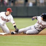 Arizona Diamondbacks' Stephen Drew, left, tags out Detroit Tigers' Magglio Ordonez as he tries to stretch a single into a double during the first inning of a baseball game against the Detroit Tigers Friday. 