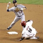 Arizona Diamondbacks' Justin Upton (10) is forced out on a double play during the eighth inning of a baseball game as Detroit Tigers' Placido Polanco throws to first Friday.