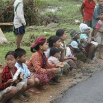 In this photo released by the Mandalay Gazette Myanmar people wait for aid along a roadside Sunday, May 18, 2008, between Phyar Pone and Bokalay, Myanmar. (AP Photo/Mandalay Gazette, HO)
