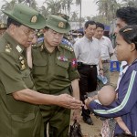 In this photo released by Myanma News Agency, Senior Gen. Than Shwe, Myanmar's junta leader, left, talks with a family survivors of Cyclone Nargis at a makeshift shelter in Myanmar Monday, May 19, 2008. Myanmar's junta on Monday announced a three-day mourning period for victims of the cyclone that left at least 130,000 people dead or missing, while the country's neighbors made plans to help distribute foreign aid to survivors. (AP Photo/Myanma News Agency, HO)
