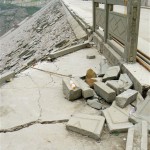 Cracks run on the top of quake-hit Zipingpu dam, near broken railings in Wenchuan, China's southwest Sichuan Province Tuesday, May 20, 2008. China said it was struggling to find shelter for many of the 5 million people whose homes were destroyed in last week's earthquake, while the confirmed death toll rose Tuesday to more than 40,000. (AP Photo/Kyodo News)