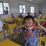 tudents smile in a new aseismic classroom of Zundao Primary School in Mianzhu of south China's Guangdong province Wednesday, May 21, 2008. China's first aseismic primary school started classes Wednesday. (AP Photo/Color China Photo)