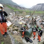Members of a South Korean rescue team prepare to search for bodies in the ruins of a sewerage treatment plant at Hongbai, in Shifang county, in China's southwest Sichuan province Wednesday May 21, 2008. The team of 41 rescue experts arrived in China on May 16, four days after a powerful earthquake devastated the region. (AP Photo/Greg Baker)
