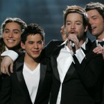 David Cook is surrounded by fellow contestants as he performs after being named the new American Idol during the season finale on Wednesday May 21, 2008, in Los Angeles. From left are: Jason Castro,David Archuleta, David Cook and Michael Johns. (Mark Mainz/AP Images for Fox)