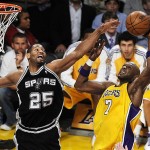 Los Angeles Lakers' Lamar Odom, right, grabs a rebound over San Antonio Spurs' Robert Horry during the second half of Game 2 of the NBA Western Conference basketball finals in Los Angeles, Friday, May 23, 2008. The Lakers won 101-71. (AP Photo/Chris Pizzello)