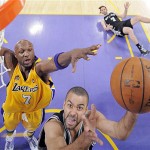 San Antonio Spurs guard Tony Parker, of France, puts up a shot as Los Angeles Lakers forward Lamar Odom (7) guards while Spurs forward Fabricio Oberto, of Argentina, fall to the floor during the first half in Game 2 of the NBA Western Conference basketball finals, Friday, May 23, 2008 in Los Angeles. (AP Photo/Mark J. Terrill)