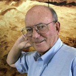 Michael Drake, director of the Lunar and Planetary Laboratory at the University of Arizona, poses in front of a photographic mural of a Venus landscape in Tucson, Ariz., Wednesday, May 14, 2008. If the Phoenix Mars Lander makes a successful touchdown in Mars' northern polar region, NASA's Jet Propulsion Laboratory in California will turn over scientific control to the Tucson lab's researchers. (AP Photo/John Miller)