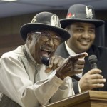 n a Saturday, Feb. 25, 2006 file photo, rock and roll legend Ellas McDaniel, better known as Bo Diddley, left, foregoes his guitar as he and his grandson, Gary Mitchell, right, sing an inspirational rap song following a ceremony in Archer,Fla. which named Saturday "Bo Diddley Day". Diddley died Monday June 2, 2008 of heart failure at his home in Archer, Fla., spokeswoman Susan Clary said. He was 79. (AP Photo/Phil Sandlin, File)