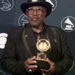 Bo Diddley holds his Grammy award for Lifetime Achievement at the 40th Annual Grammy Awards on Feb. 25, 1998, at Radio City Music Hall in New York. A spokeswoman says Diddley died of heart failure Monday, June 2, in Florida. He was 79. (AP Photo/Richard Drew, File)