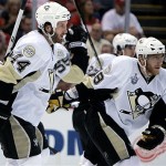 Pittsburgh Penguins defenseman Brooks Orpik (44) and teammate forward Marian Hossa (18) of Slovakia skate back to the bench after celebrating Hossa's goal during first period hockey action in Game 5 of the Stanley Cup finals in Detroit, Monday, June 2, 2008. (AP Photo/Gene Puskar)