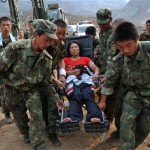 Soldiers evacuate an injured earthquake survivor from Hongguang Village in Qingchuan County in Guangyuan, in southwest China's Sichuan province Thursday, June 5, 2008. (AP Photo/Color China Photo)
