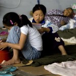 Two Chinese students study in a temporary shelter for earthquake refugees in Mianyang, China's southwest Sichuan province, Saturday, June 7, 2008. (AP Photo/Alexander F. Yuan)
