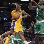 Los Angeles Lakers guard Kobe Bryant (24) tries to pass against the defense of Boston Celtics center Kendrick Perkins, back, and Kevin Garnett (5) in the first half of Game 3 of the NBA basketball finals Tuesday, June 10, 2008, in Los Angeles. (AP Photo/Mark J. Terrill)