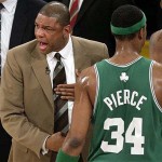 Boston Celtics head coach Doc Rivers, left, yells during a break against the Los Angeles Lakers in the first half of Game 3 of the NBA basketball finals Tuesday, June 10, 2008, in Los Angeles. Celtics' Paul Pierce (34) walks to the bench. (AP Photo/Mark Avery)