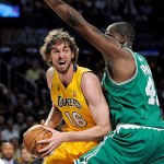 Los Angeles Lakers forward Pau Gasol (16), of Spain, tries to pass around Boston Celtics center Kendrick Perkins during the first half of Game 4 of the NBA basketball finals Thursday.