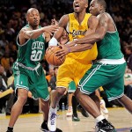 Los Angeles Lakers guard Kobe Bryant, center, has the ball knocked away by Boston Celtics center Kendrick Perkins, right, and Ray Allen (20) in the first half of Game 4 of the NBA basketball finals Thursday.