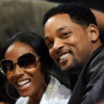 Actors Jada Pinkett Smith, left, and her husband, Will Smith watch the Los Angeles Lakers play the Boston Celtics in the first half of Game 4 of the NBA basketball finals Thursday.