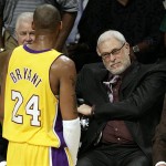 Los Angeles Lakers guard Kobe Bryant talks to coach Phil Jackson and assistant coach Tex Winter, partially obscured by Bryant, in the first half of Game 4 of the NBA basketball finals against the Boston Celtics on Thursday.