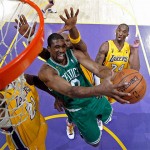 Boston Celtics forward Leon Powe (0) tries to shoot against the defense of Los Angeles Lakers forward Ronny Turiaf (21) Lamar Odom and Kobe Bryant (24) in the first half of Game 4 of the NBA basketball finals Thursday.