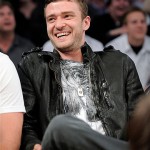 Singer Justin Timberlake laughs after he made a funny face for the cameras as he watched Game 4 of the NBA basketball finals between the Los Angeles Lakers and the Boston Celtics on Thursday.