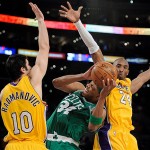 Boston Celtics forward Paul Pierce (34) can't get past the defense of Los Angeles Lakers forward Vladimir Radmanovic (10), of Serbia, and Kobe Bryant (24) in the second half of Game 4 of the NBA basketball finals Thursday.
