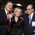 In this Nov. 14, 2007, file photo NBC's Meet the Press host Tim Russert, left, greets former Federal Reserve Chairman Alan Greenspan, right, and his wife, Chief Foreign Affairs Correspondent for NBC News, Andrea Mitchell, center, at the 60th anniversary celebration of NBC's Meet the Press at the Newseum in Washington. (AP Photo/Charles Dharapak, File)